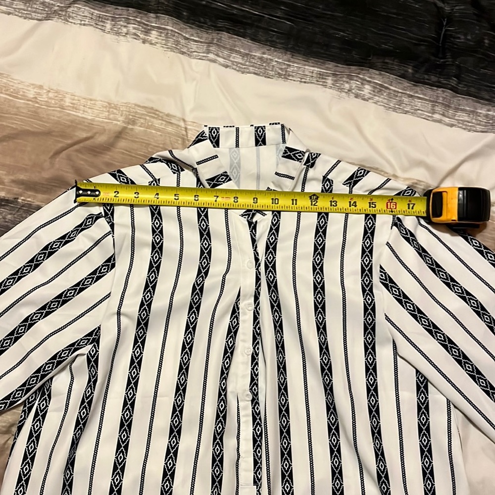 Long sleeve XL black and white blouse. 4 buttons in the front.